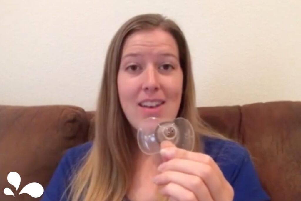 An IBCLC consultant demonstrates how to correctly use a nipple shield, offering expert advice.