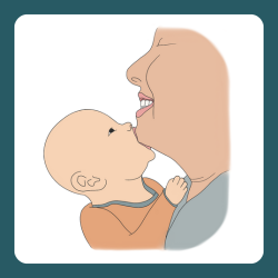 A baby sucking on a caregiver's chin, indicating an early hunger cue.