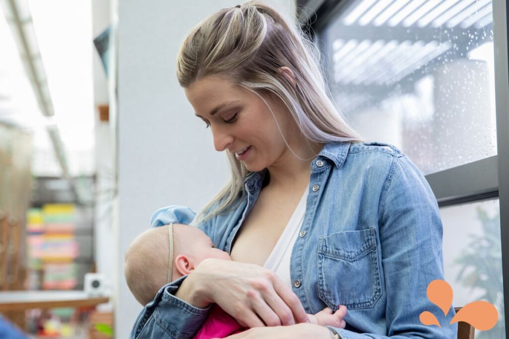 mom breastfeeding in store