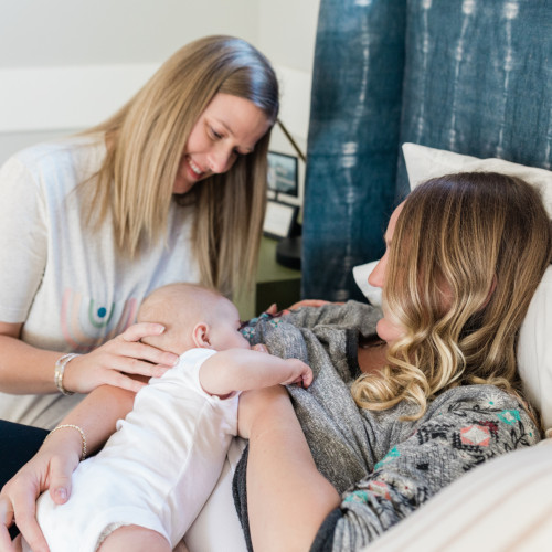 Anna Burch, IBCLC helping mom with laid back position